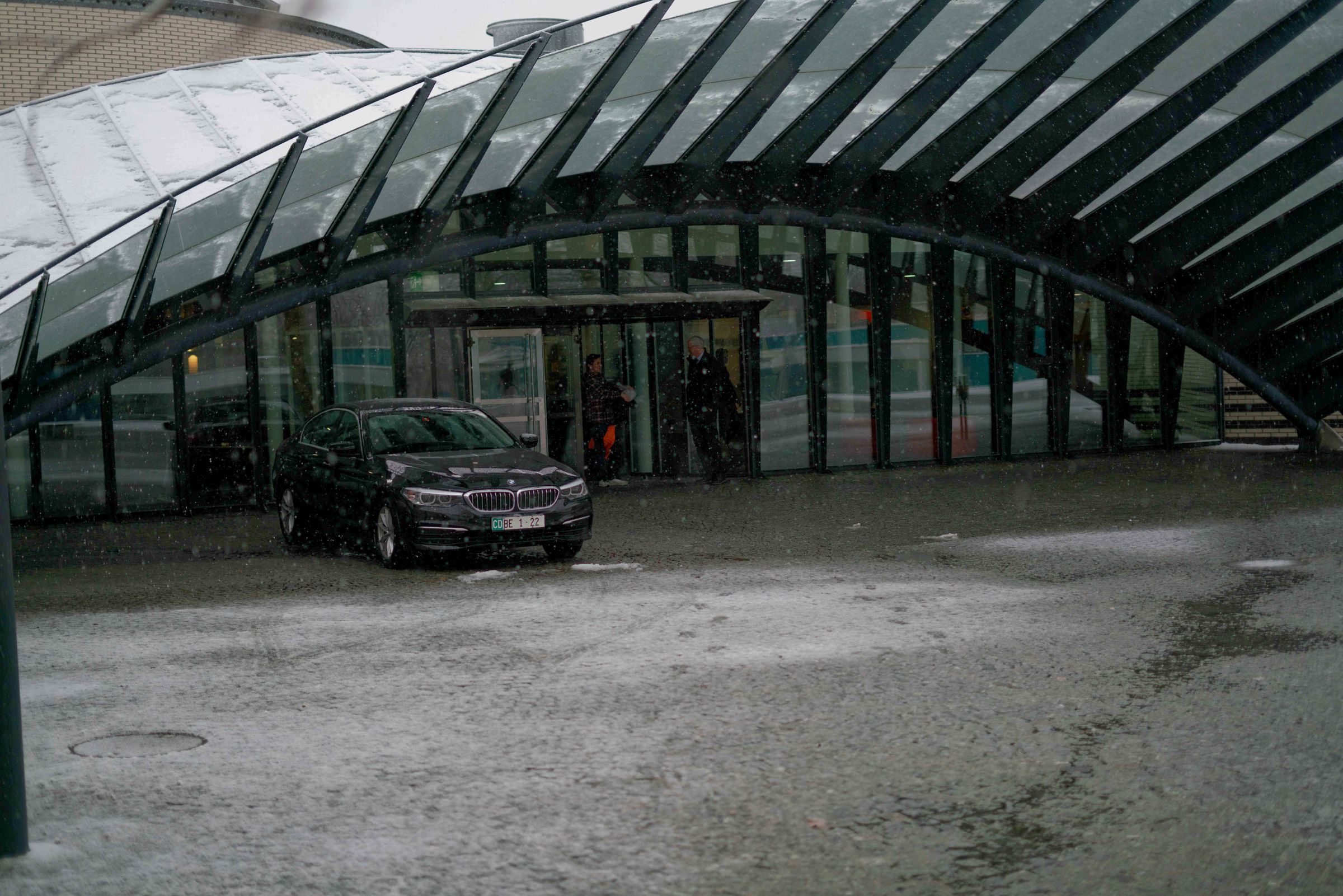 Event photography outside a modern venue in the snow
